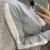 Прогулянковий костюм в спортивному стилі з лампасами декорованими стрічкою з люрексом сірий Vincenove